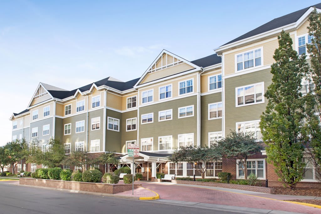 A multi-story residential building with a welcoming entrance.