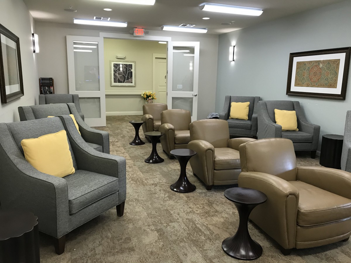 A modern waiting room with comfortable seating and stylish decor.