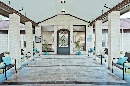 A spacious and modern lobby with a welcoming entrance, featuring comfortable seating and ample natural light.