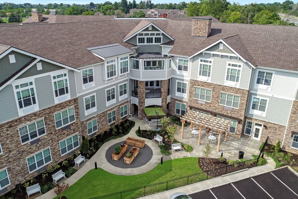 Aerial view of a modern residential building with a landscaped courtyard.