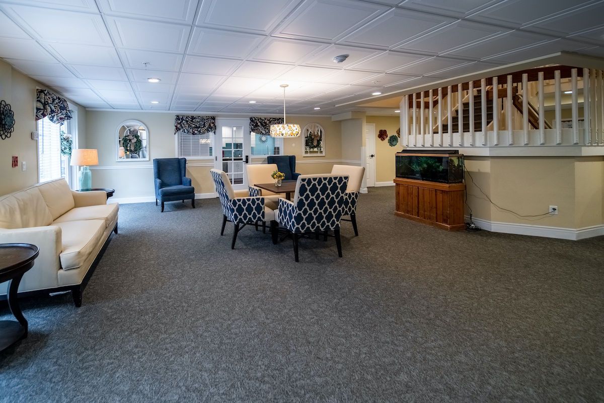 A cozy living room with a central seating area and decorative elements.