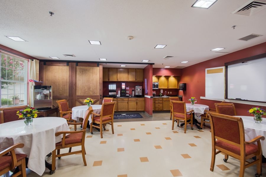 An indoor dining area with neatly arranged tables and chairs.