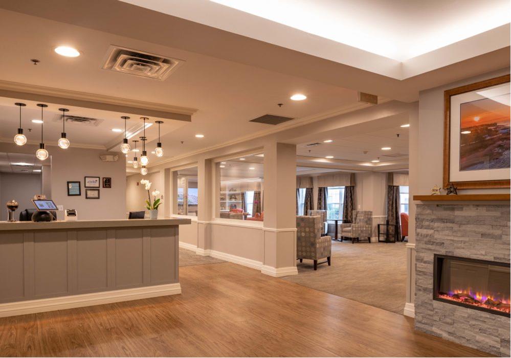 A modern reception area with stylish lighting and a spacious hallway.