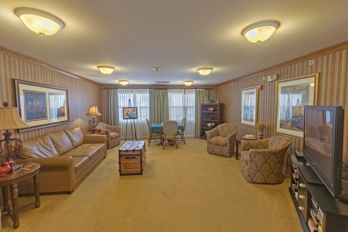 A cozy living room with comfortable seating and warm lighting.