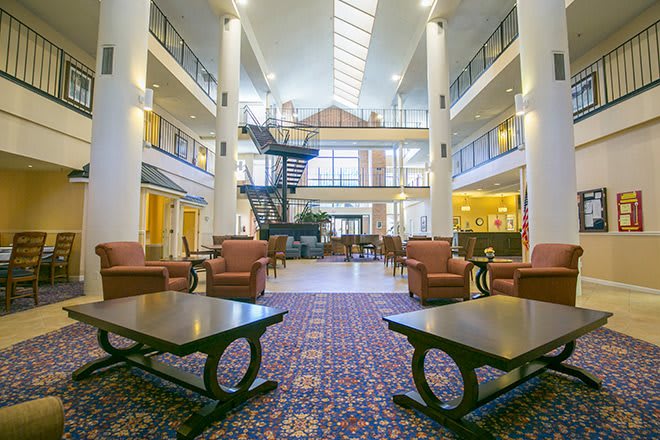 Spacious hotel lobby with comfortable seating and elegant decor.