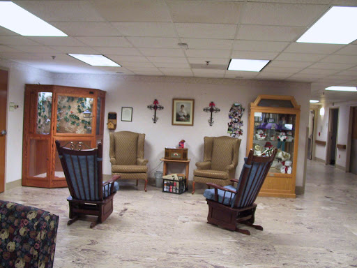 A cozy waiting area featuring rocking chairs and decorative elements.