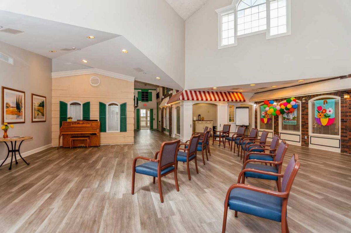 A spacious community area with chairs arranged for a gathering.