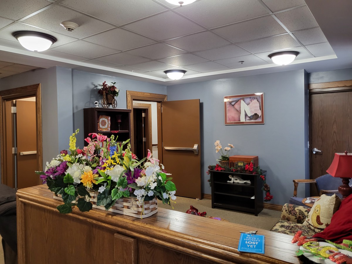 A welcoming reception area with floral arrangements and comfortable seating.