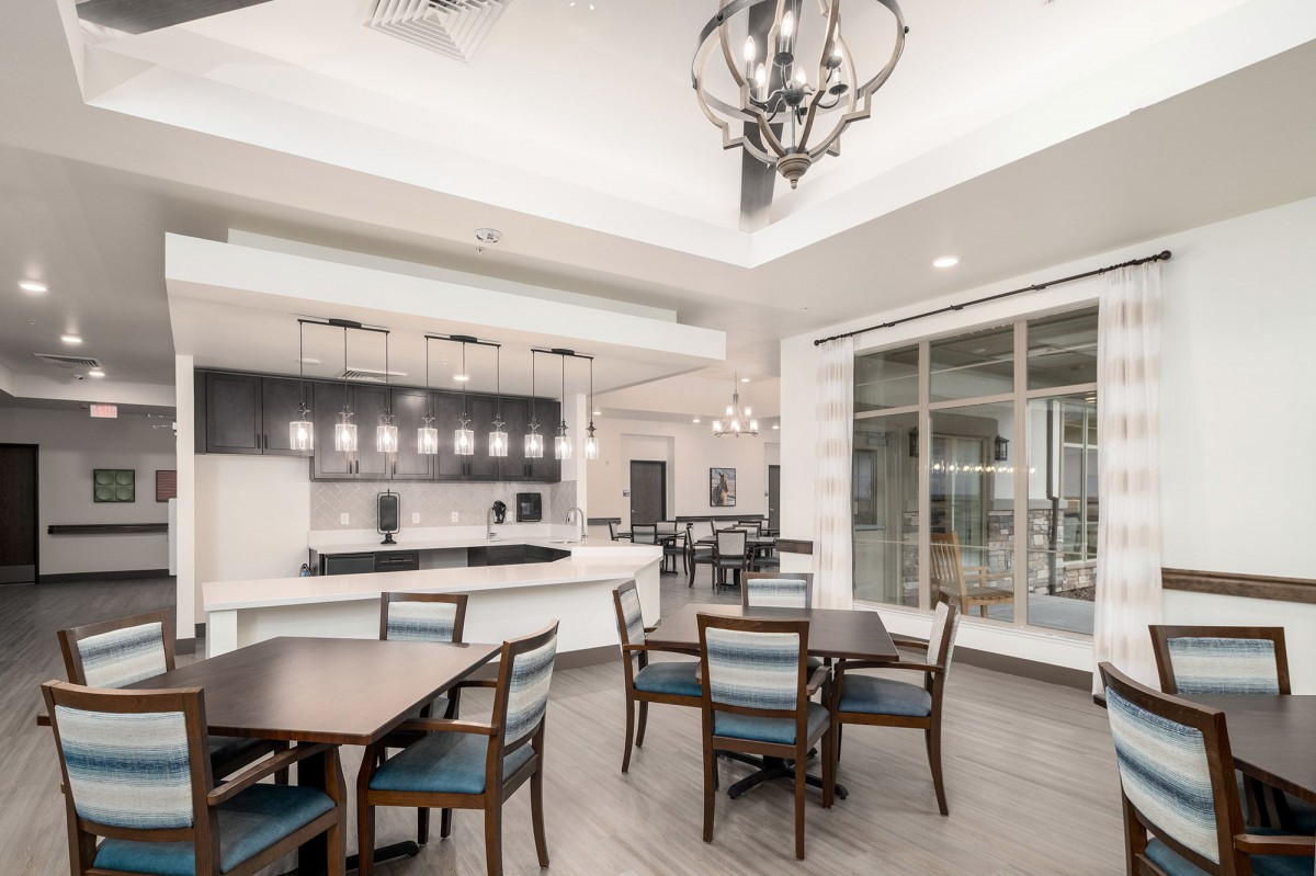 A modern dining area with stylish furniture and contemporary lighting fixtures.