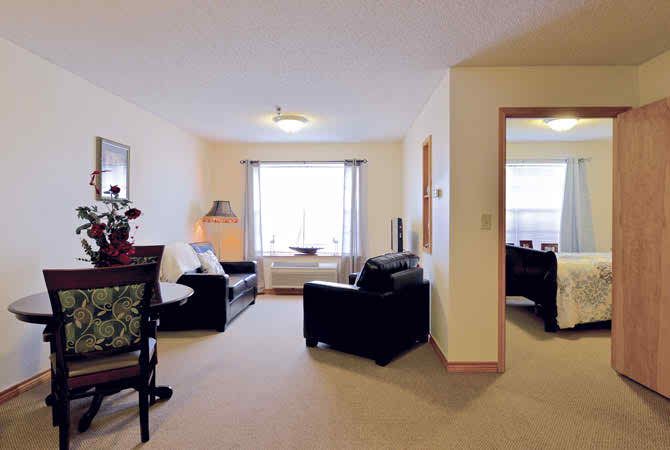 A cozy living room with comfortable seating and natural light.