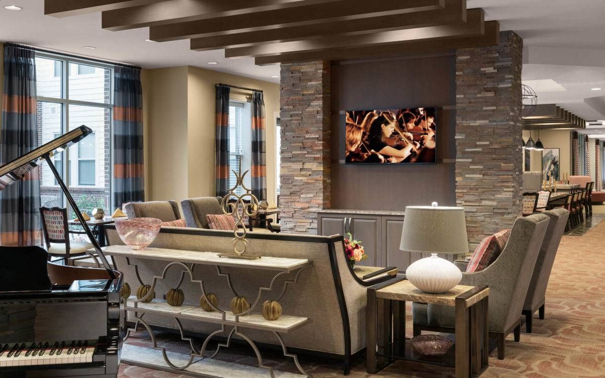 A modern living room with stylish furniture and decorative elements.