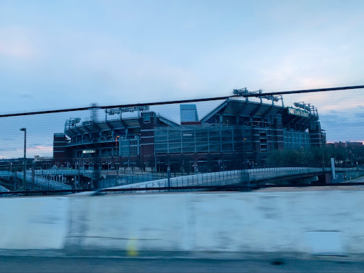 A view of a sports stadium during a cloudy evening.