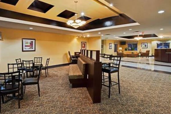A cozy restaurant interior with booth seating and tables.