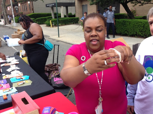 A vendor showcasing her products at a community event.