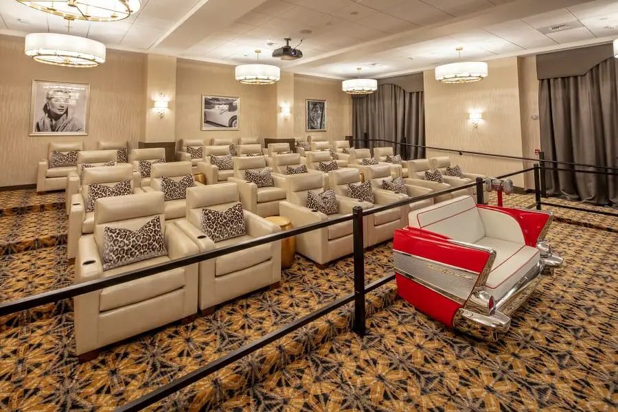 A cozy and luxurious small theater with plush seating designed for an intimate home cinema experience.