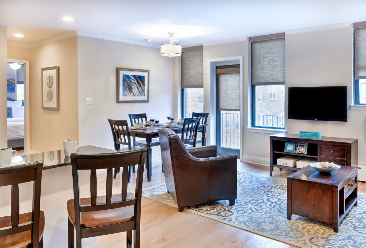 A modern apartment living and dining area with stylish furniture and decor.