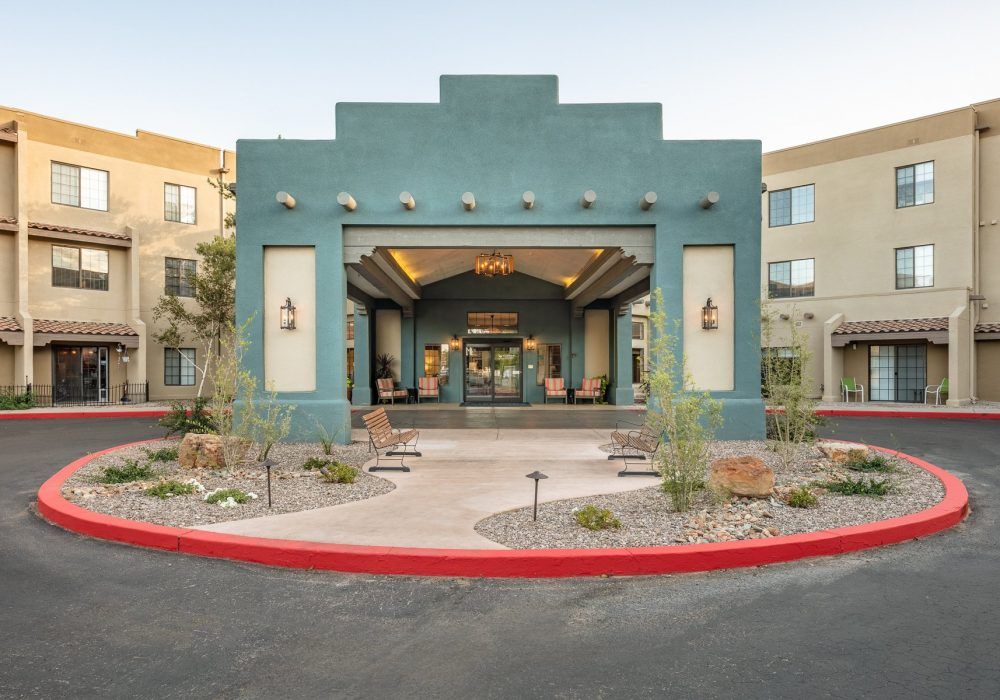 A modern building entrance with distinctive architectural features and landscaped surroundings.