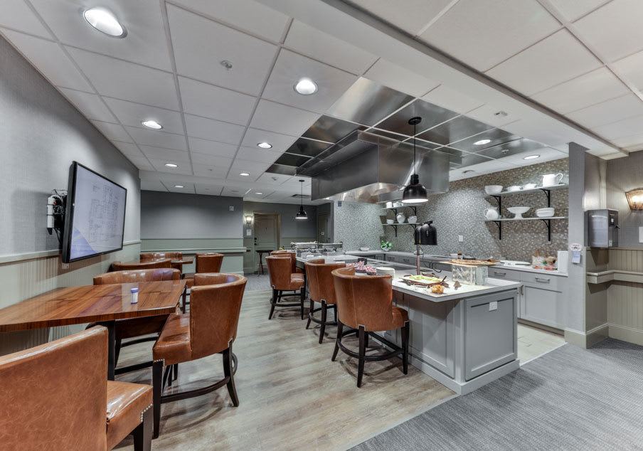 A modern restaurant interior with neatly arranged tables and chairs.