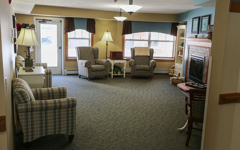 A cozy living room with comfortable chairs and a television.