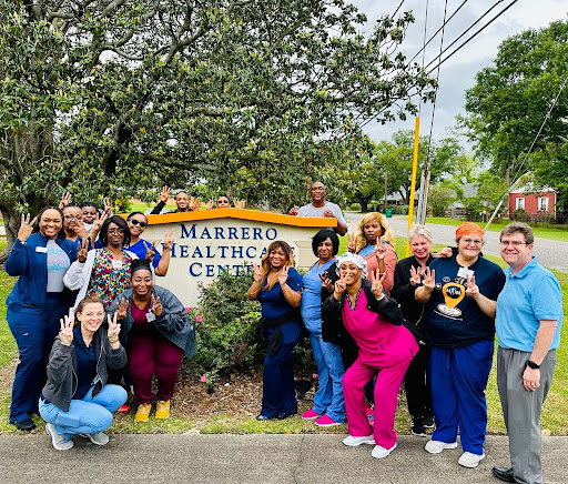 Healthcare professionals celebrating together at Marrero Healthcare Center.