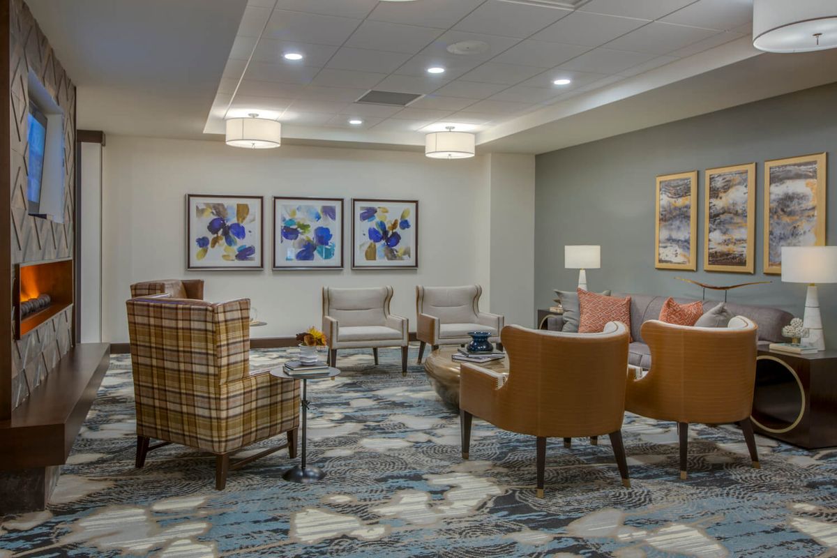 A modern lobby with comfortable seating and artistic decor.
