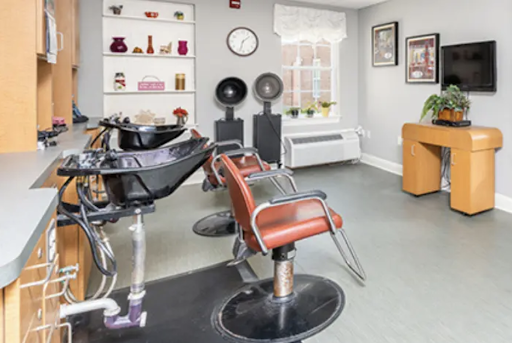 A modern hair salon featuring styling chairs and equipment, designed for comfortable hair treatments.