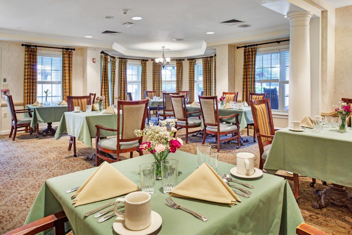 A well-decorated dining area with neatly arranged tables and chairs.
