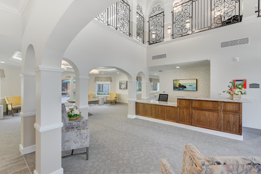 A bright and elegant reception area featuring modern architecture and spacious design.