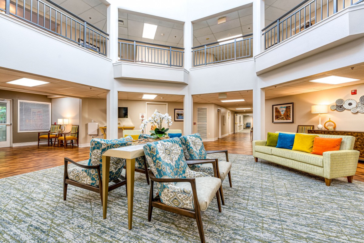 A modern and spacious lobby featuring comfortable seating arrangements and vibrant decor.