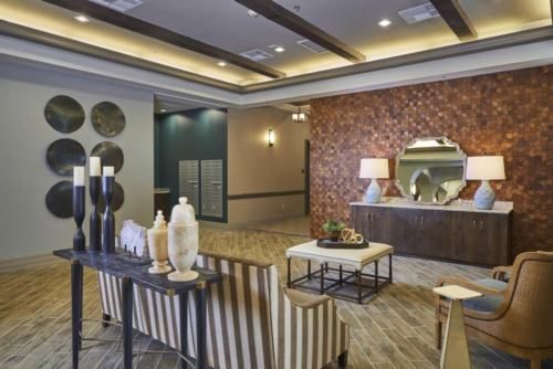 Modern lobby with stylish decor and warm lighting.