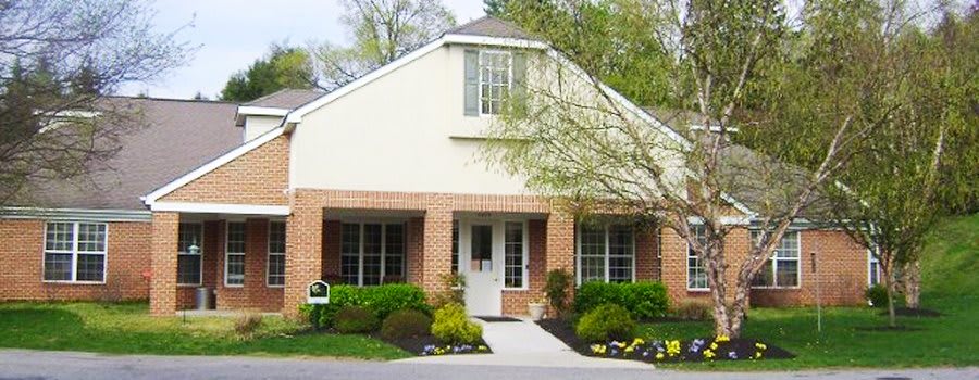 A suburban house with well-maintained landscaping and a welcoming entrance.