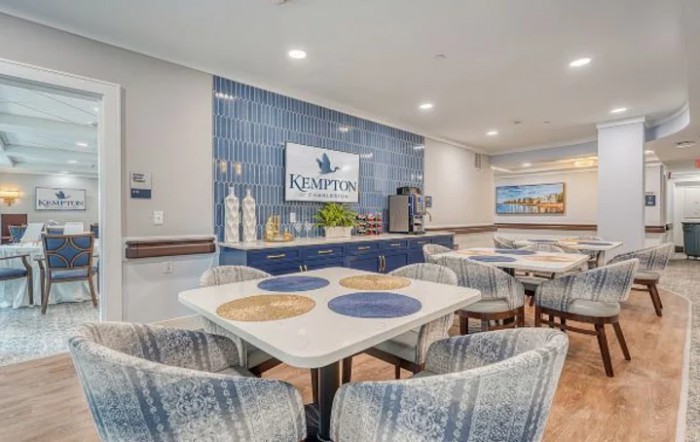 A modern hotel lobby with a stylish seating area and decorative accents.