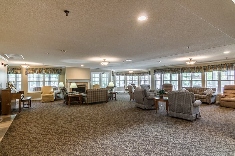 A spacious lobby with comfortable seating and large windows.