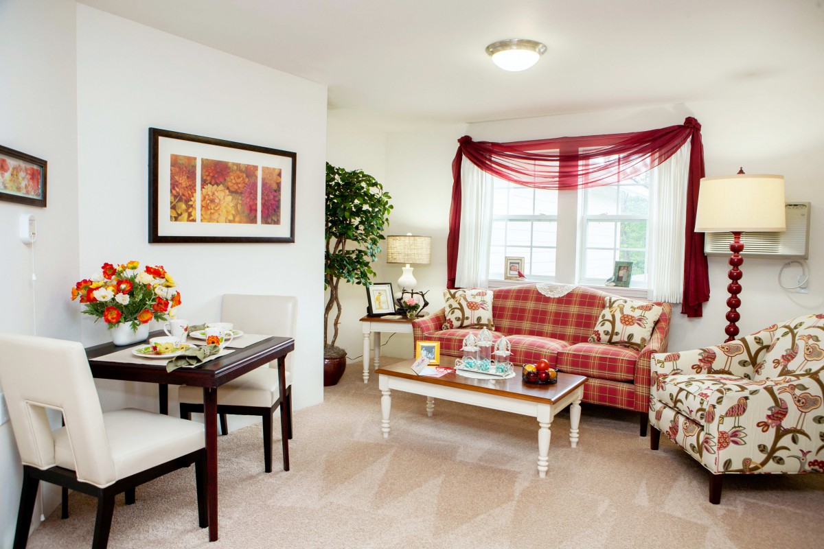 A cozy living room with elegant furniture and a warm color scheme.