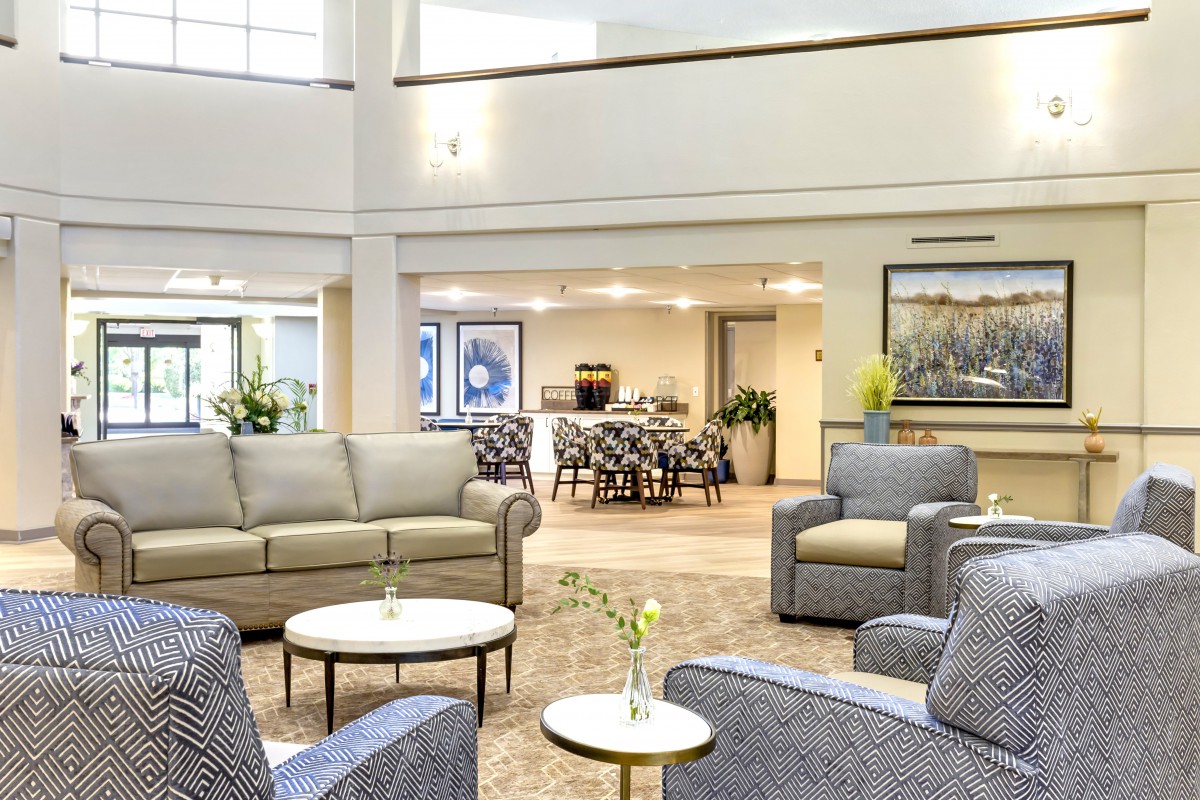 A spacious and modern lobby with comfortable seating areas and elegant decor.