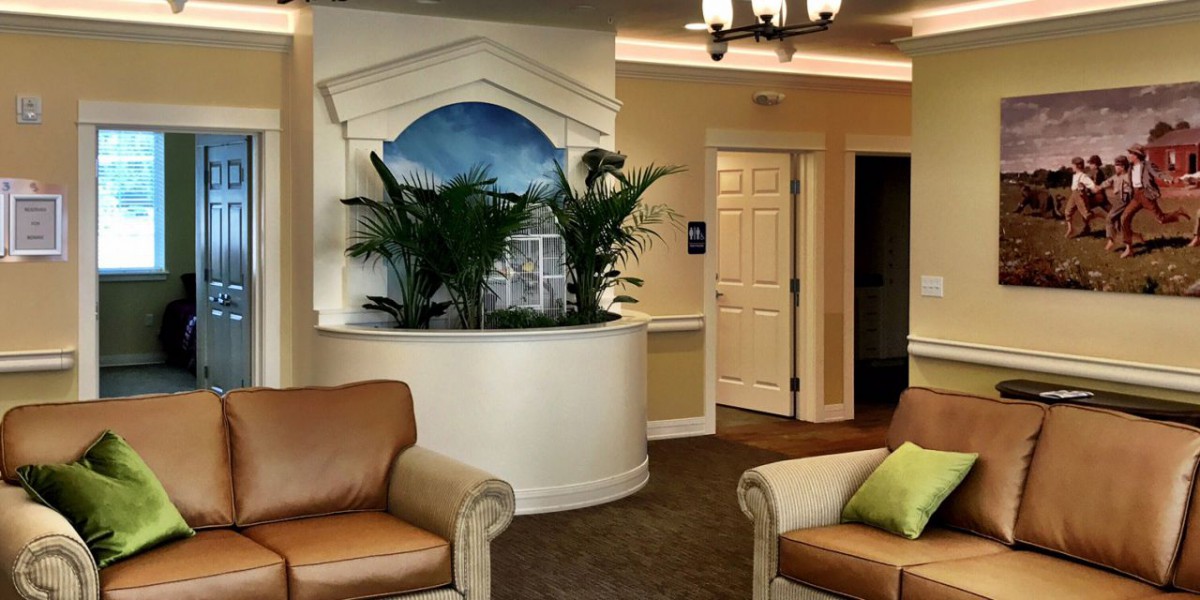 A cozy lobby area featuring comfortable seating, decorative plants, and elegant interior design.