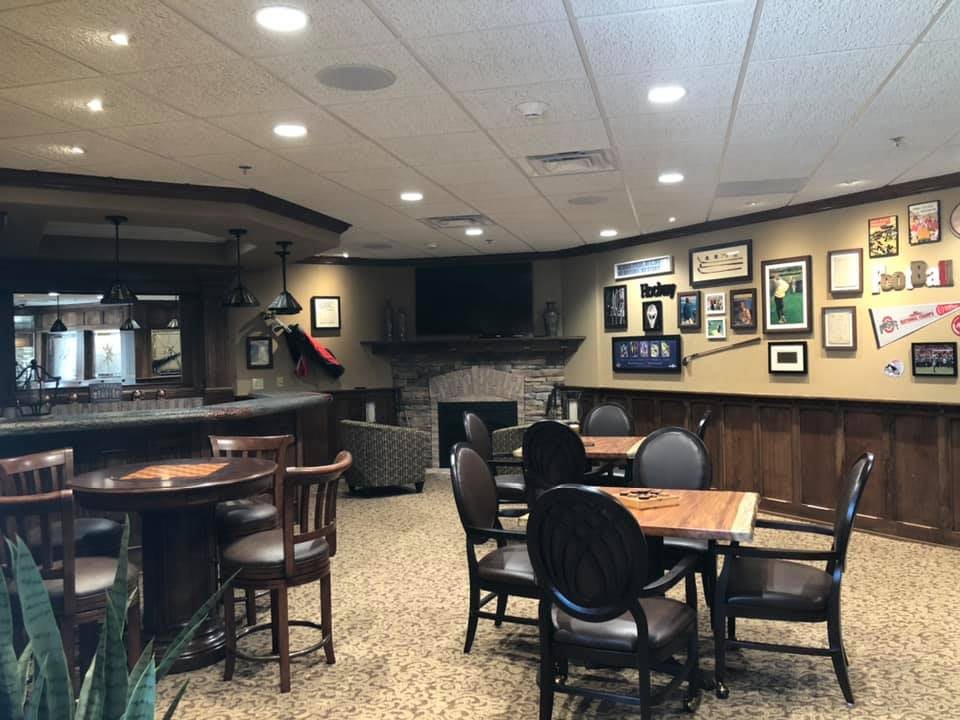 Cozy pub interior with tables and wall decor.