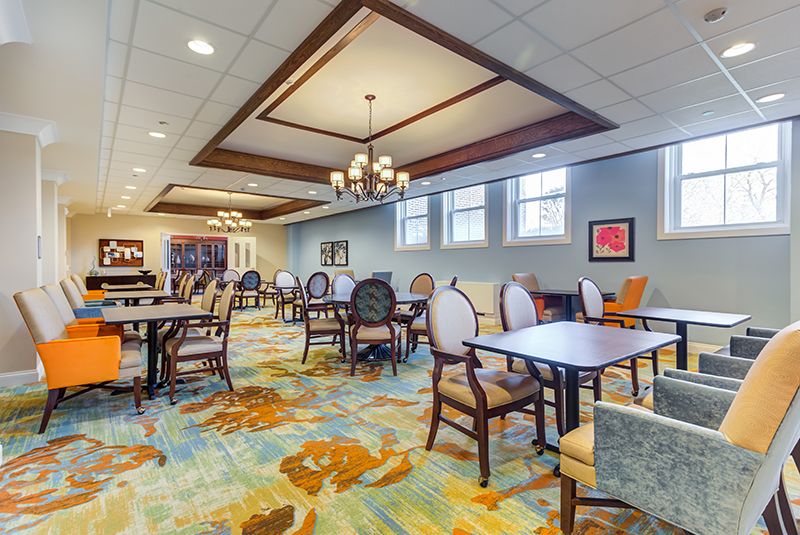 Spacious dining area with elegant decor and ample natural light.
