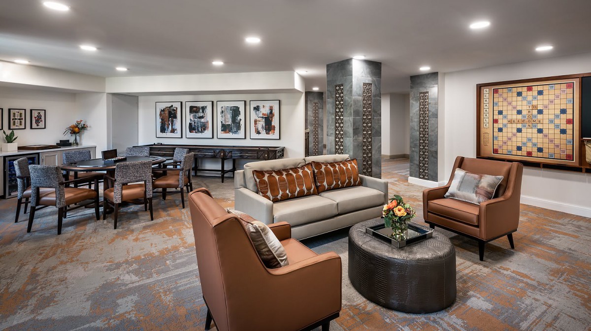 A modern living room with stylish furniture and artwork.