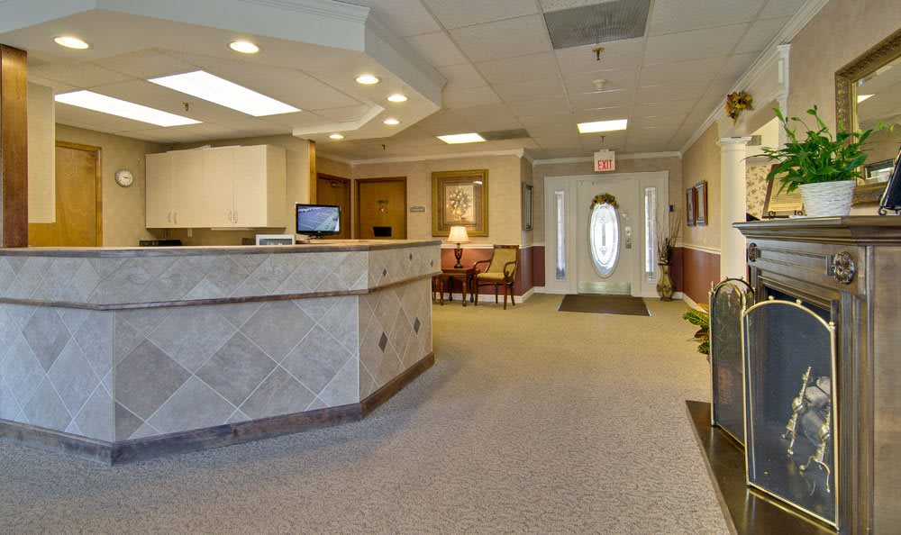 A welcoming reception area with a desk, seating, and neutral decor.