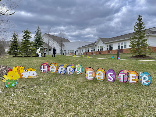 A cheerful Easter display featuring colorful decorations wishing everyone a Happy Easter.