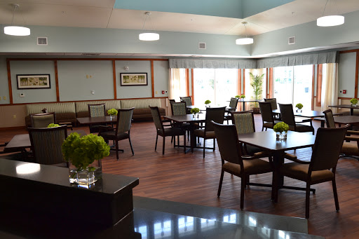 A bright and inviting dining area with tables and chairs set up for guests.