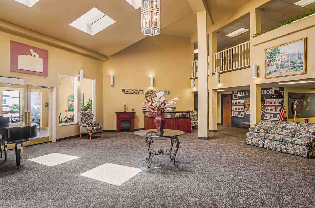 A welcoming lobby area featuring elegant decor, comfortable seating, and natural lighting.