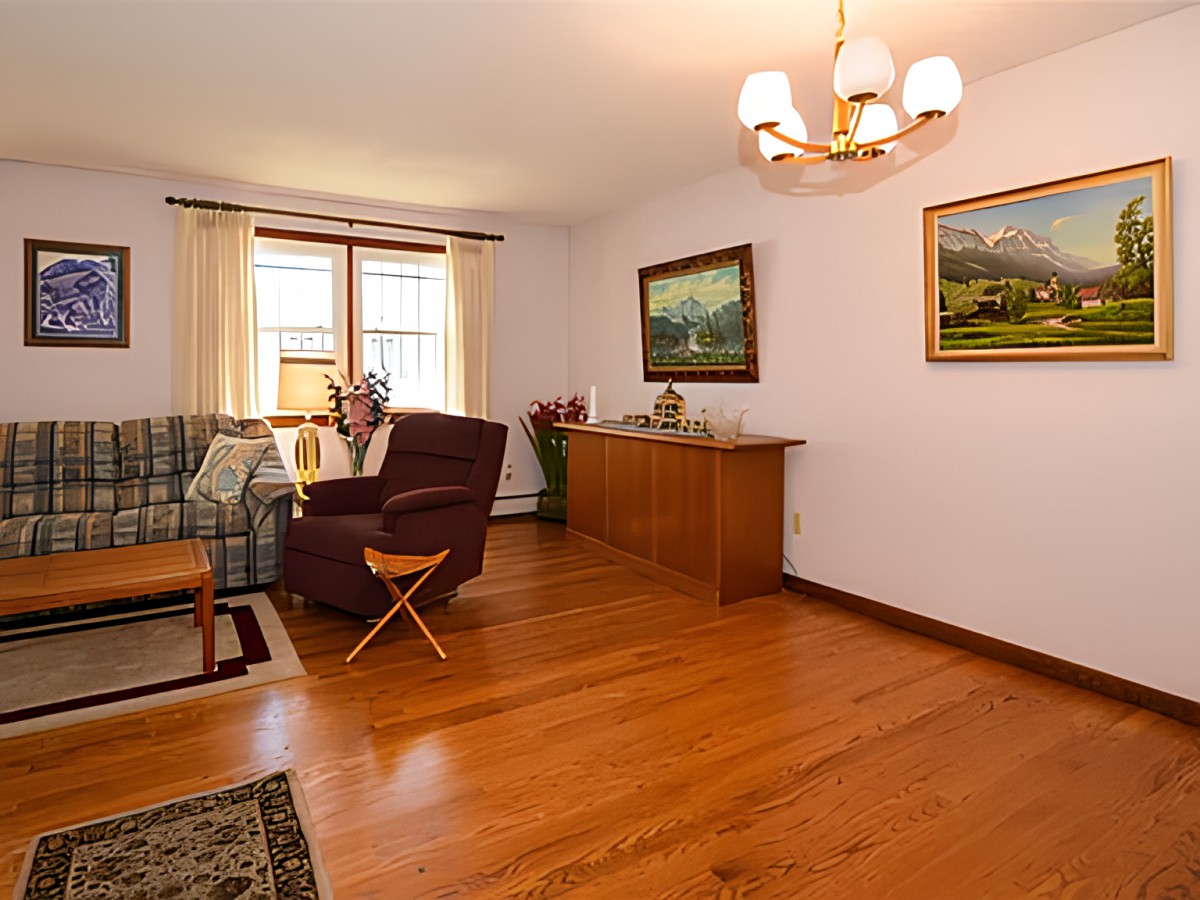 A cozy living room with hardwood floors and elegant decor.