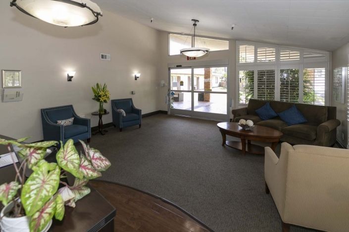 A cozy lobby area with comfortable seating and elegant lighting.