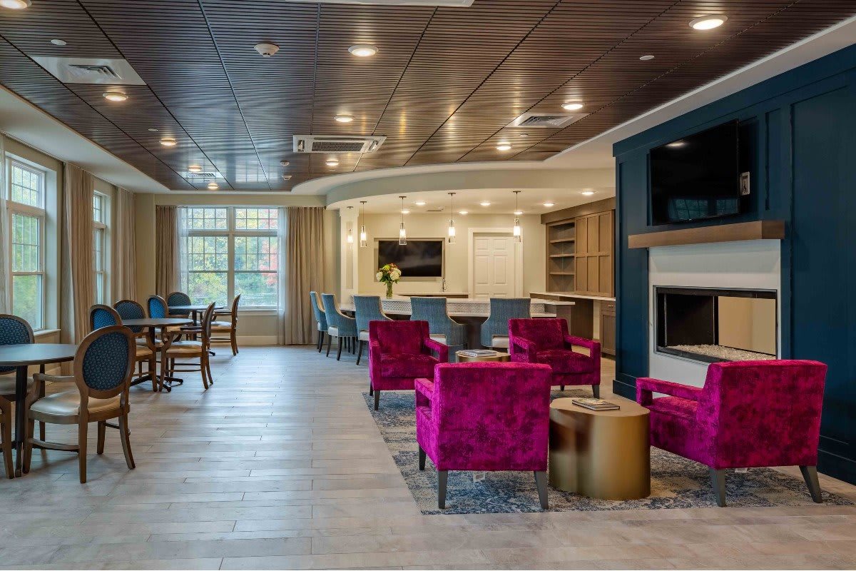 A modern and cozy living room with vibrant seating and elegant design.