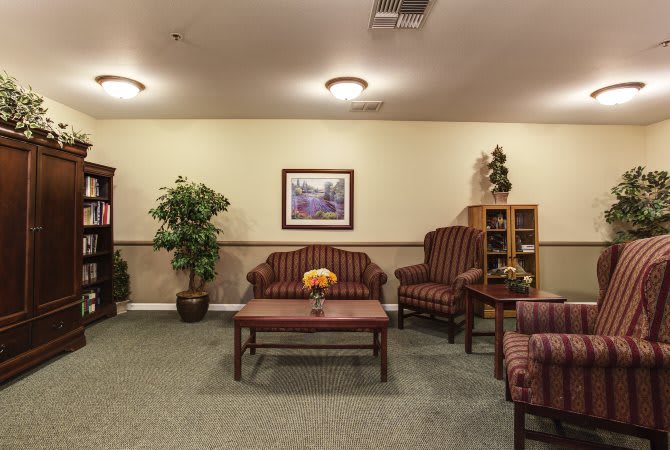 A cozy living room with traditional furniture and decor.