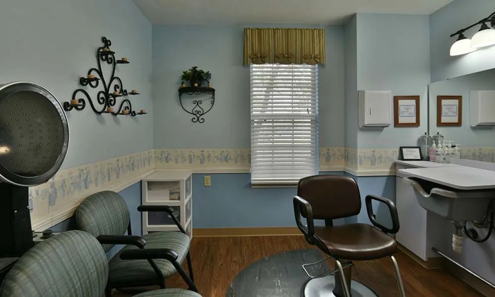 A cozy waiting room with chairs and a window.