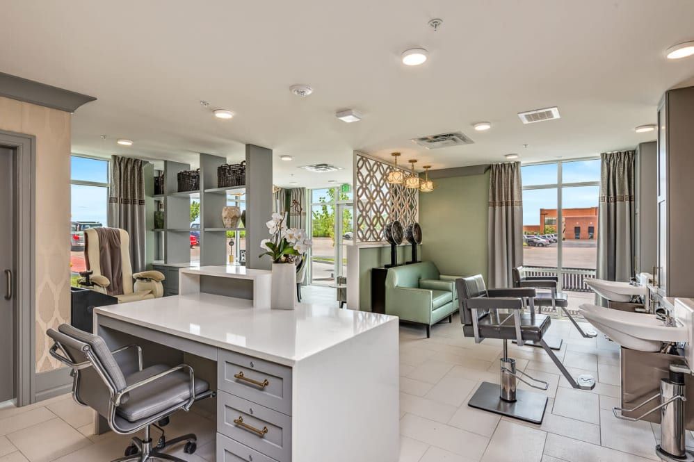 A modern hair salon interior with stylish decor and furnishings.