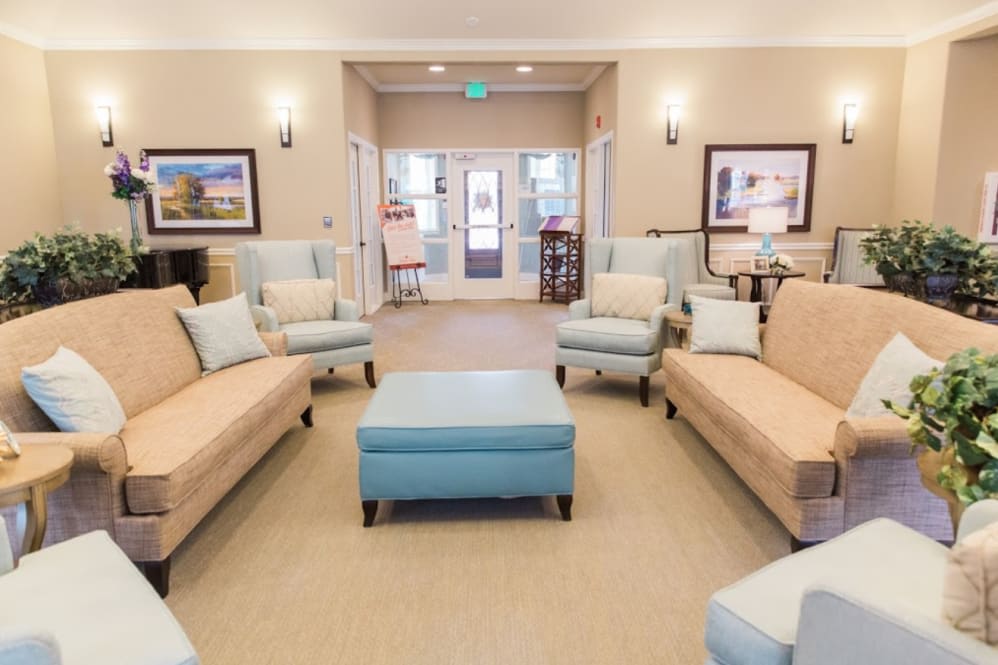 A cozy and elegant living room with comfortable seating and tasteful decor.